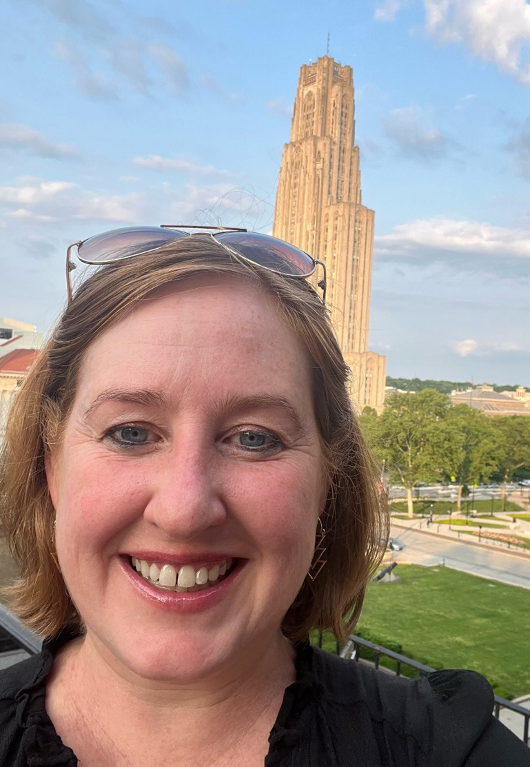 Laurie Speranzo in front of the Cathedral of Learning